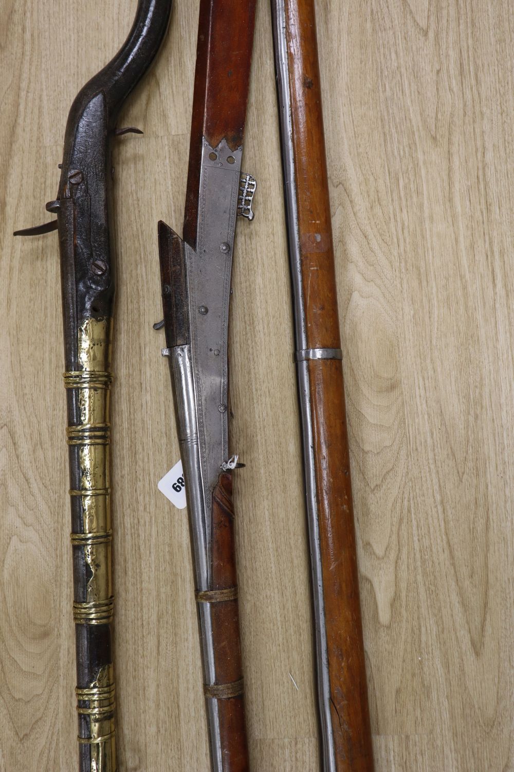A long musket, overall 90 inches and two further longarms, all with ram-rods